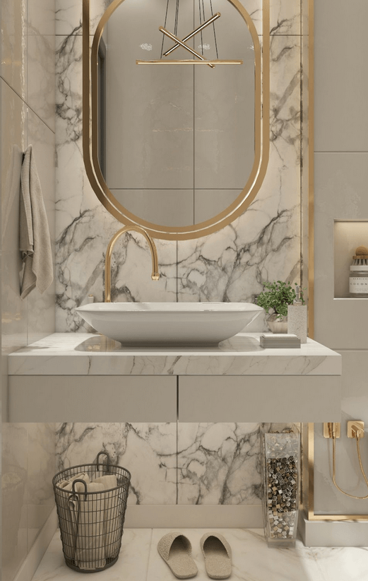 Lavabo de manos en marmol con detalles dorados